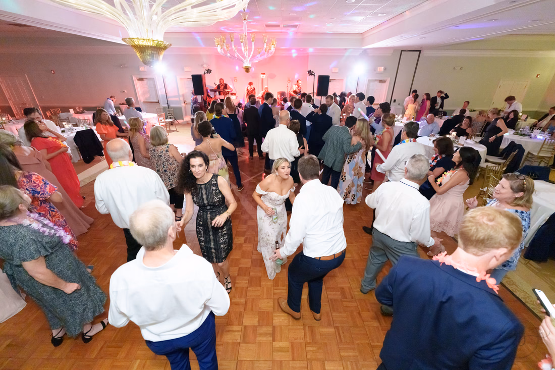 Wide view of guests dancing under the chandeliers at Pawleys Plantation
