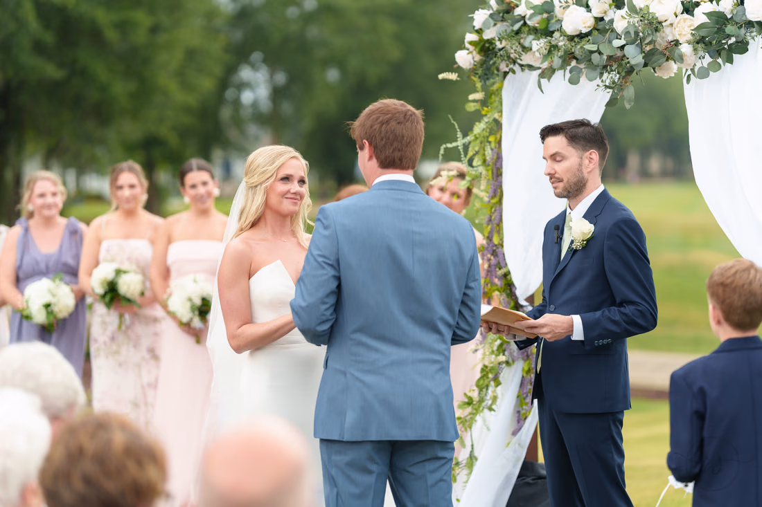 Bride getting emotional looking at groom during the ceremony - Pawleys Plantation
