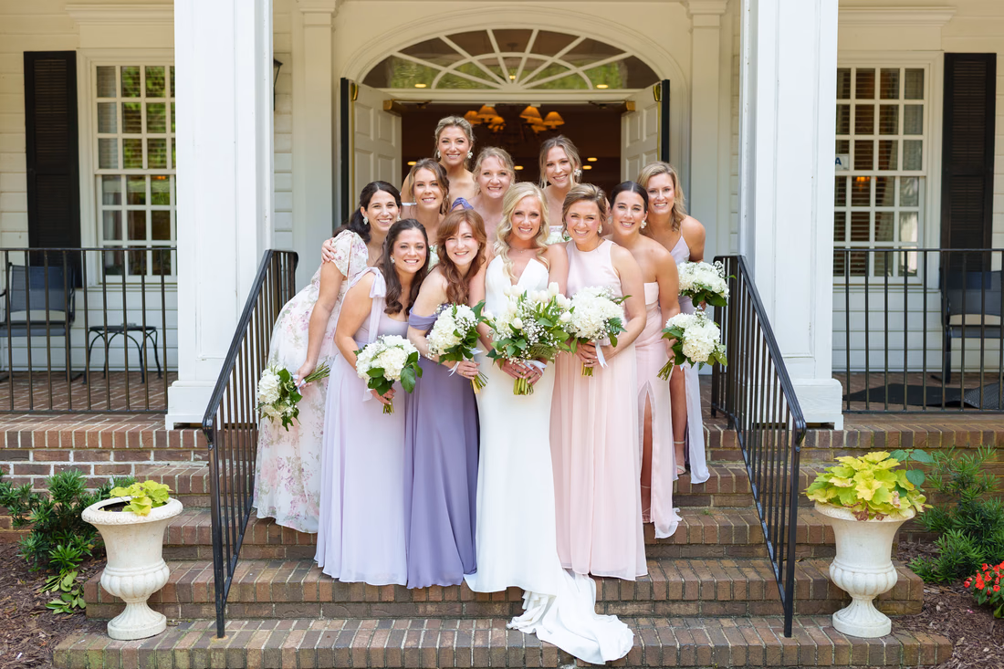 Bride with bridesmaids on the side of the clubhouse - Pawleys Plantation