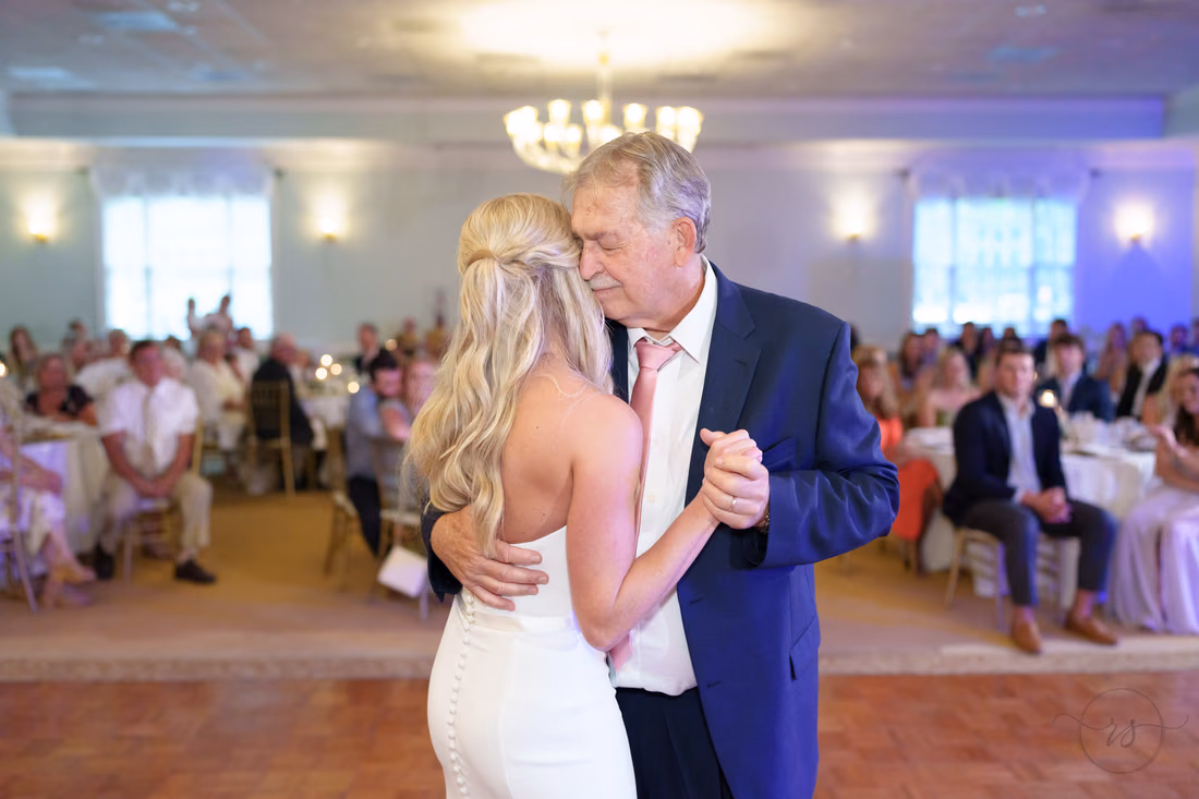Bride and her father dance beneath the chandelier at Pawleys Plantation