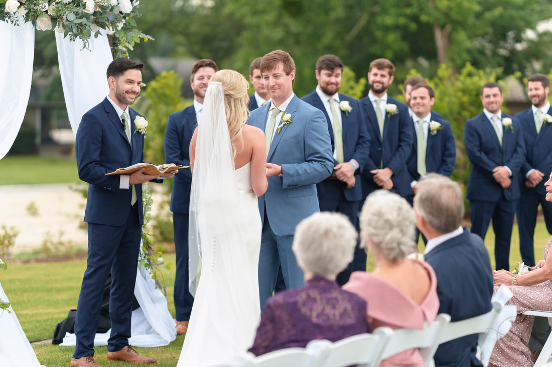 Groom looking at bride during vows - Pawleys Plantation