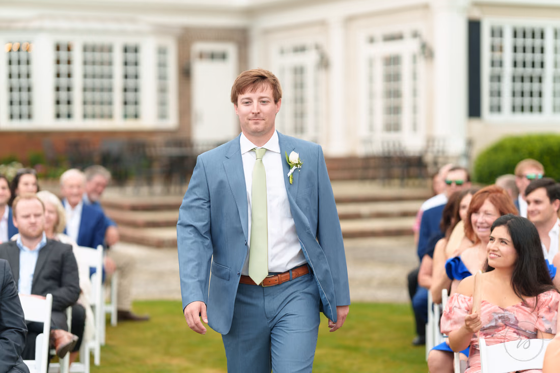 Groom walks down the aisle to start the ceremony at Pawleys Plantation