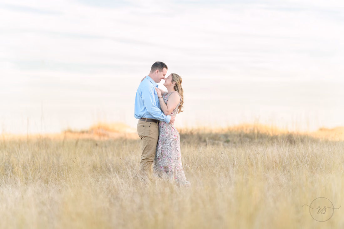 Couple embracing in tall golden grass - Cherry Grove Point