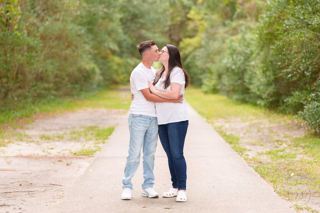Rainy day engagement pictures with a nice sunset - Huntington Beach State Park