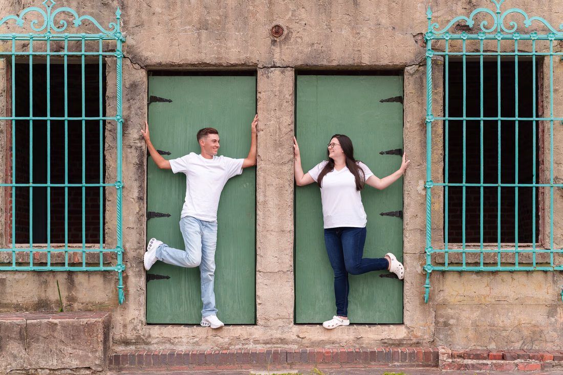 Couple posing in the green doorways of Atalaya Castle - Huntington Beach State Park