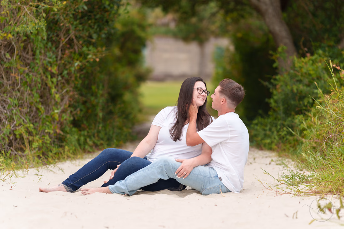 Couple sitting together on the sandy path - Huntington Beach State Park