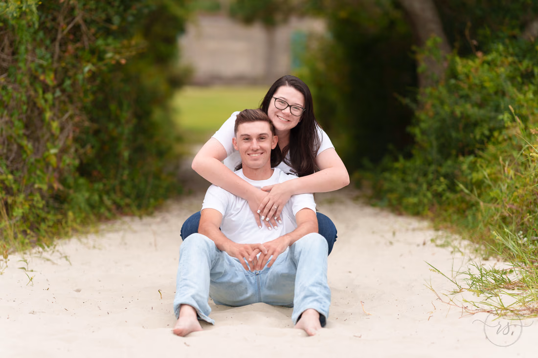 She hugs him from behind after the rain - Huntington Beach State Park