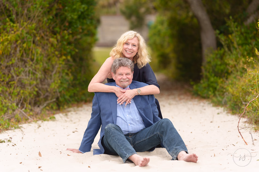 Senior couple sitting on the shaded beach path - Huntington Beach State Park