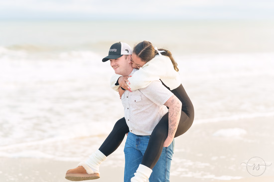 Piggyback ride by the surf after the proposal - Huntington Beach State Park