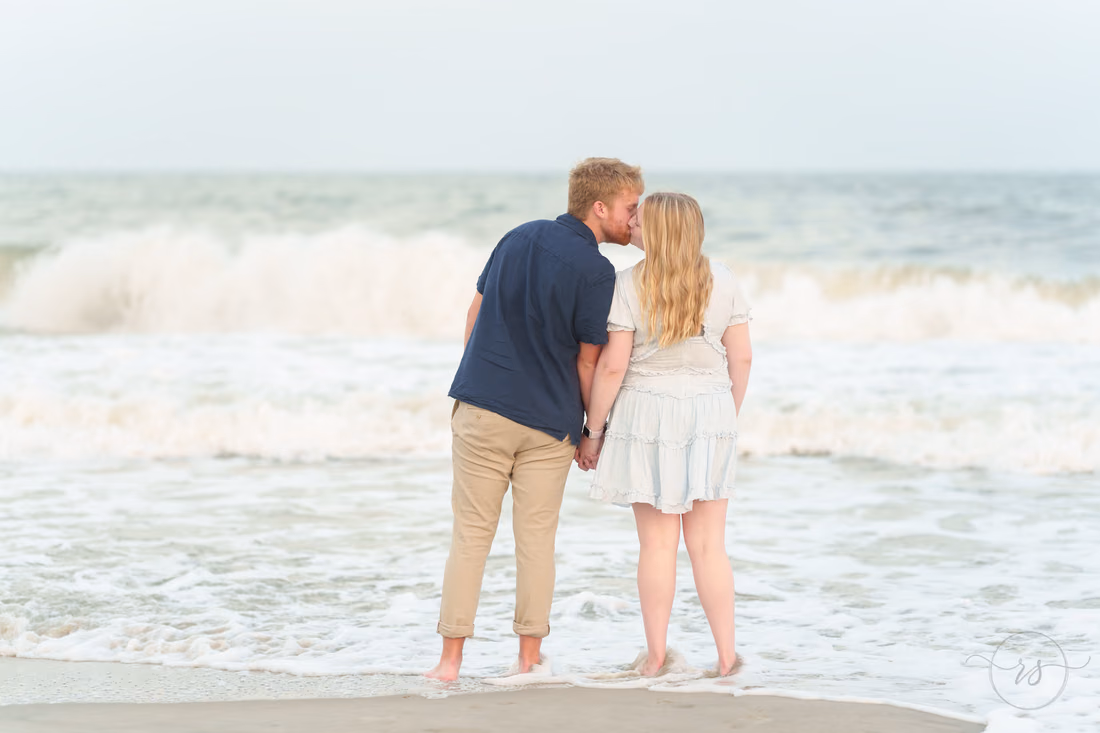 Couple kissing in the surf - Huntington Beach State Park