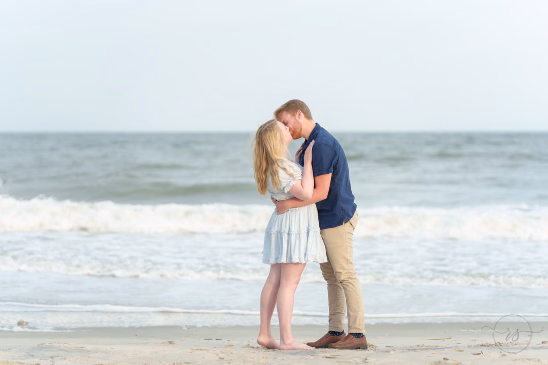 Couple kissing by the waves after the proposal - Huntington Beach State Park