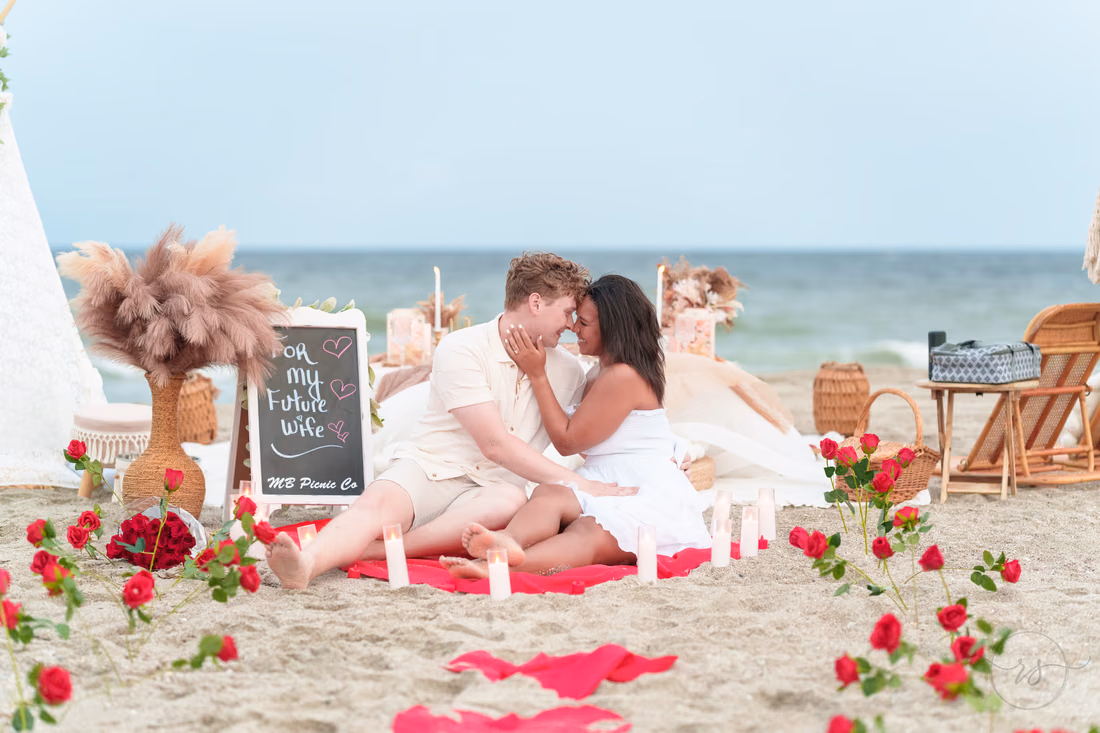 Couple on the picnic blanket among red roses - Myrtle Beach