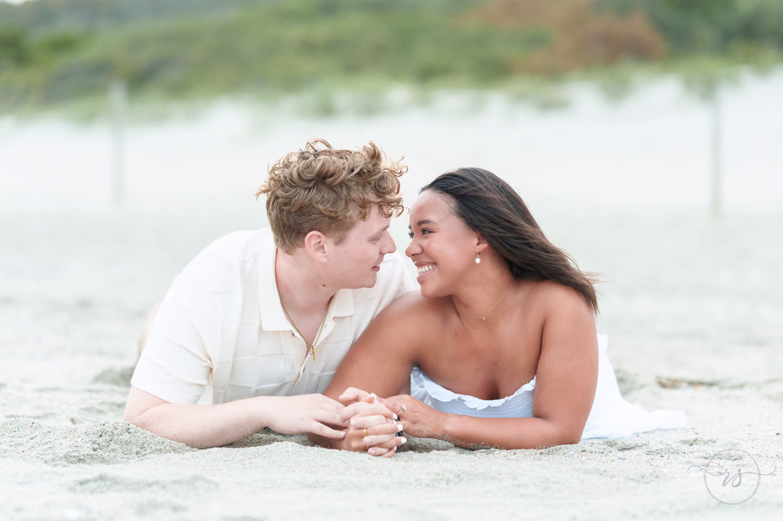 Couple lying in the sand gazing at each other - Myrtle Beach