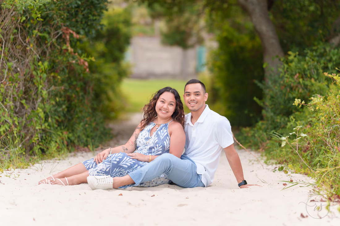 Couple relaxing in the sand on the shaded path - Huntington Beach State Park