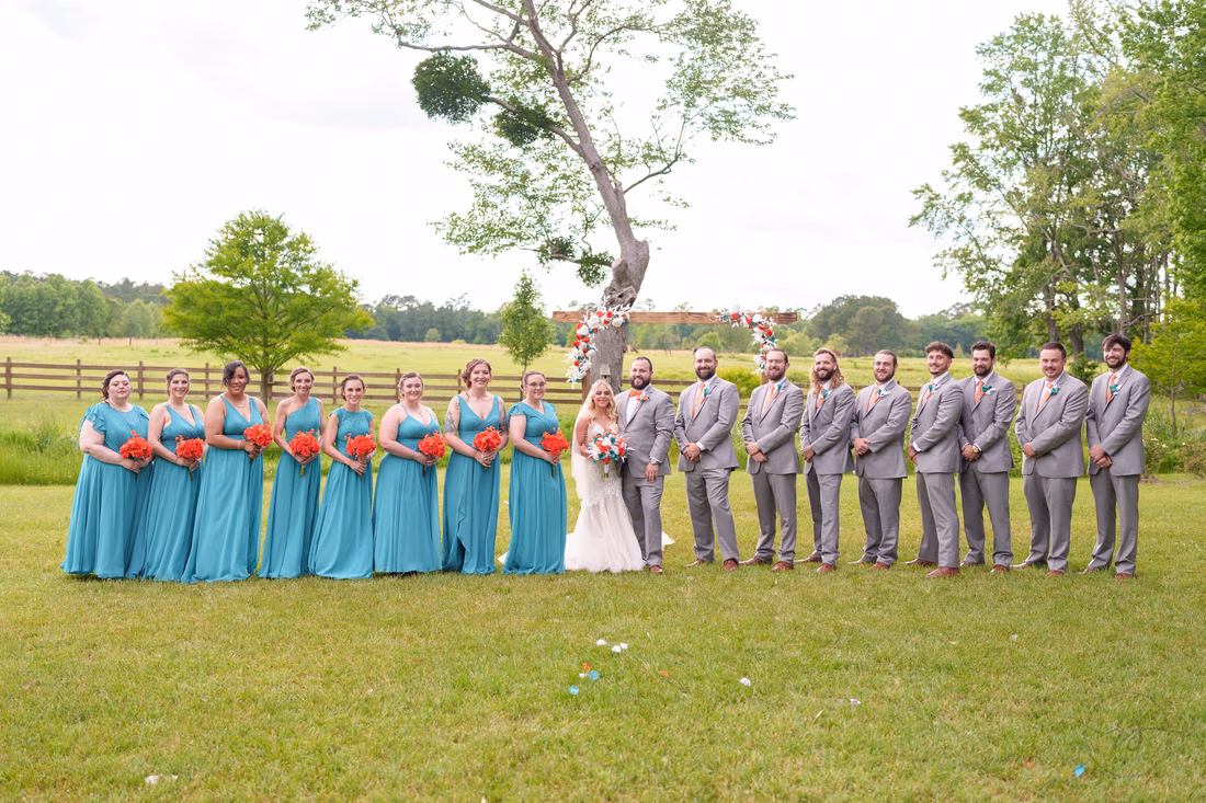 Big wedding party in front of the pasture - Wildhorse at Parker Farms