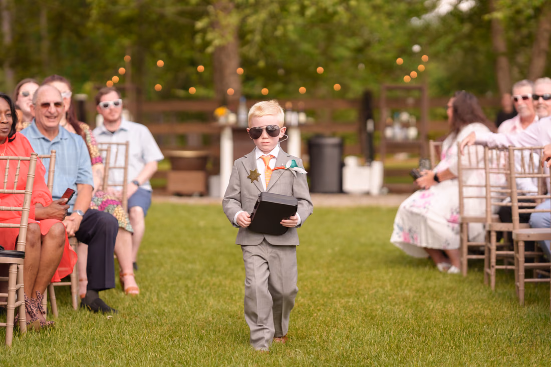 Ring bearer with security case and sunglasses - Wildhorse at Parker Farms