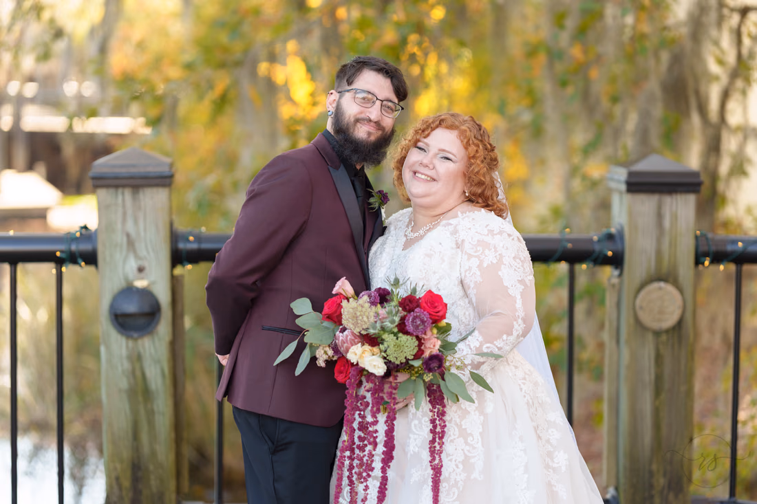 Bride and groom in front of the trees on the riverwalk - The Cypress Inn - Conway, SC