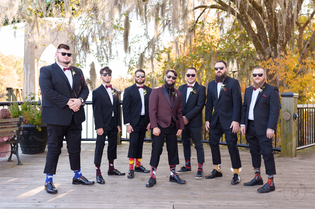 Groomsmen showing off their socks - The Cypress Inn - Conway, SC