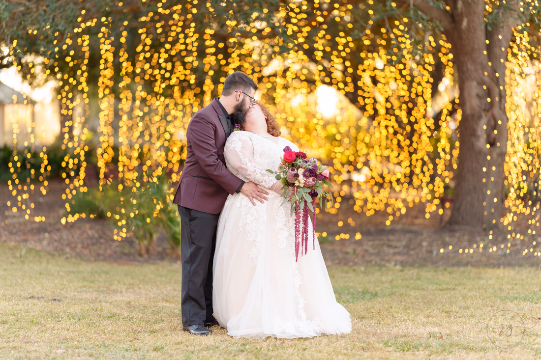 Kiss under the lights hanging from the trees - The Cypress Inn - Conway, SC