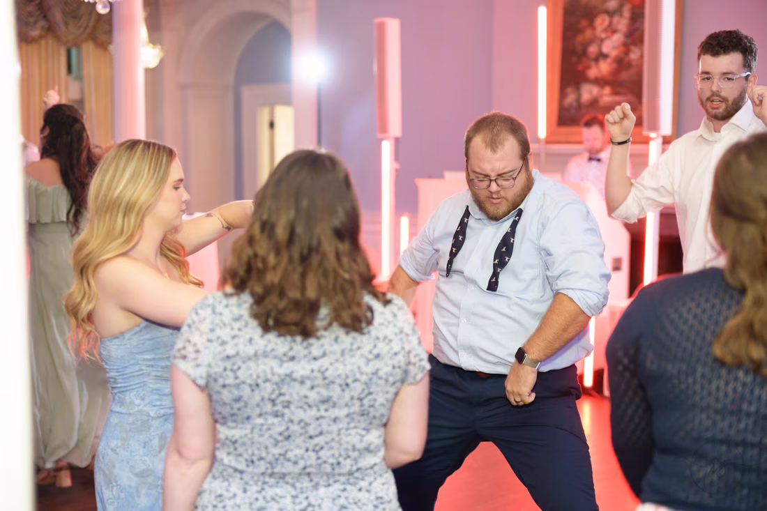 A guest in suspenders shows off his dance moves at Pine Lakes Country Club
