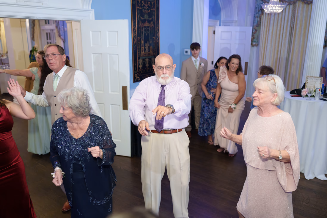 Older guests dance together on the dance floor at Pine Lakes Country Club