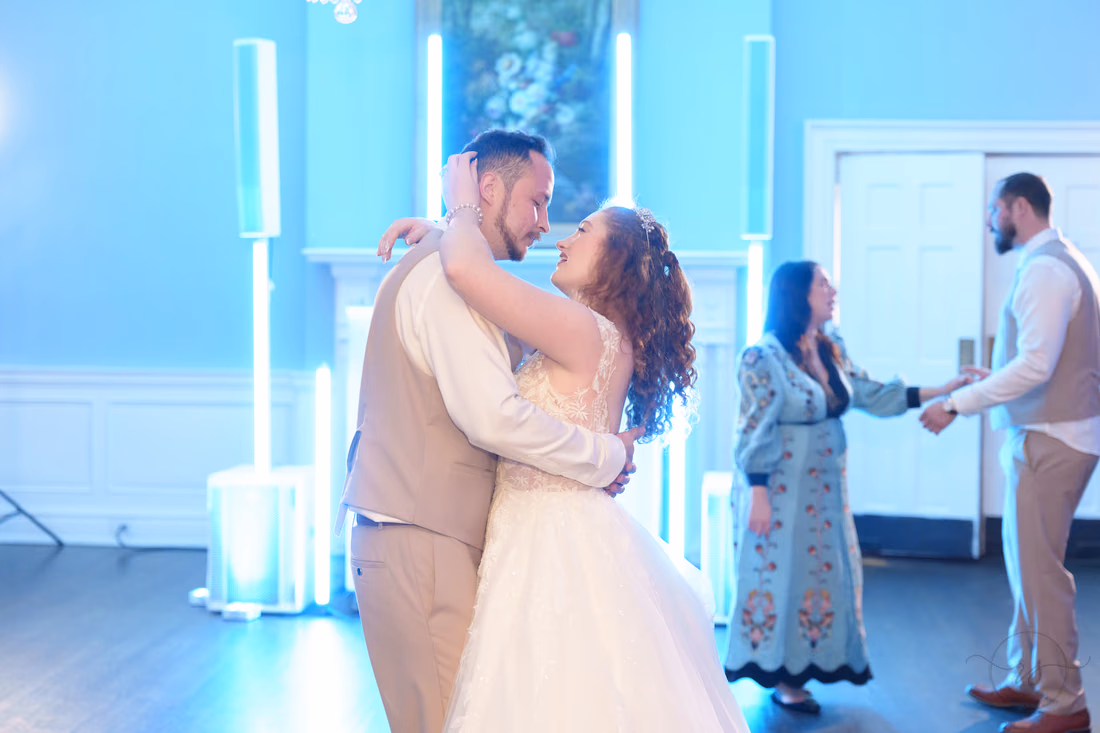 The bride and groom hold each other close during a last dance at Pine Lakes Country Club