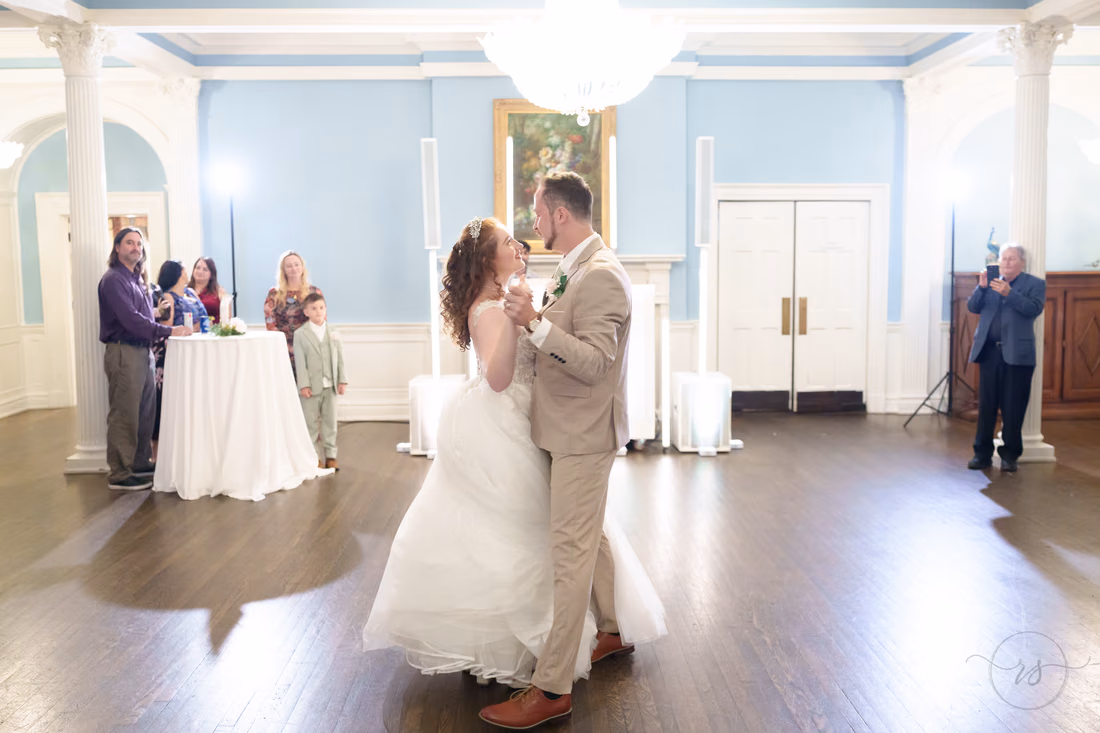 The bride and groom dance close during their first dance at Pine Lakes Country Club