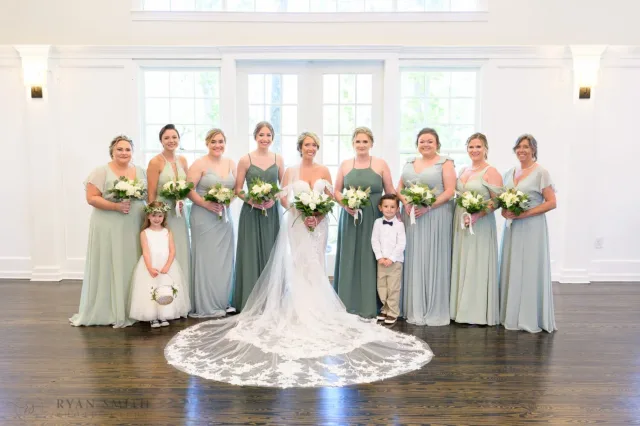 Bride with her bridesmaids, flower girl and ring bearer inside The Village House at Litchfield