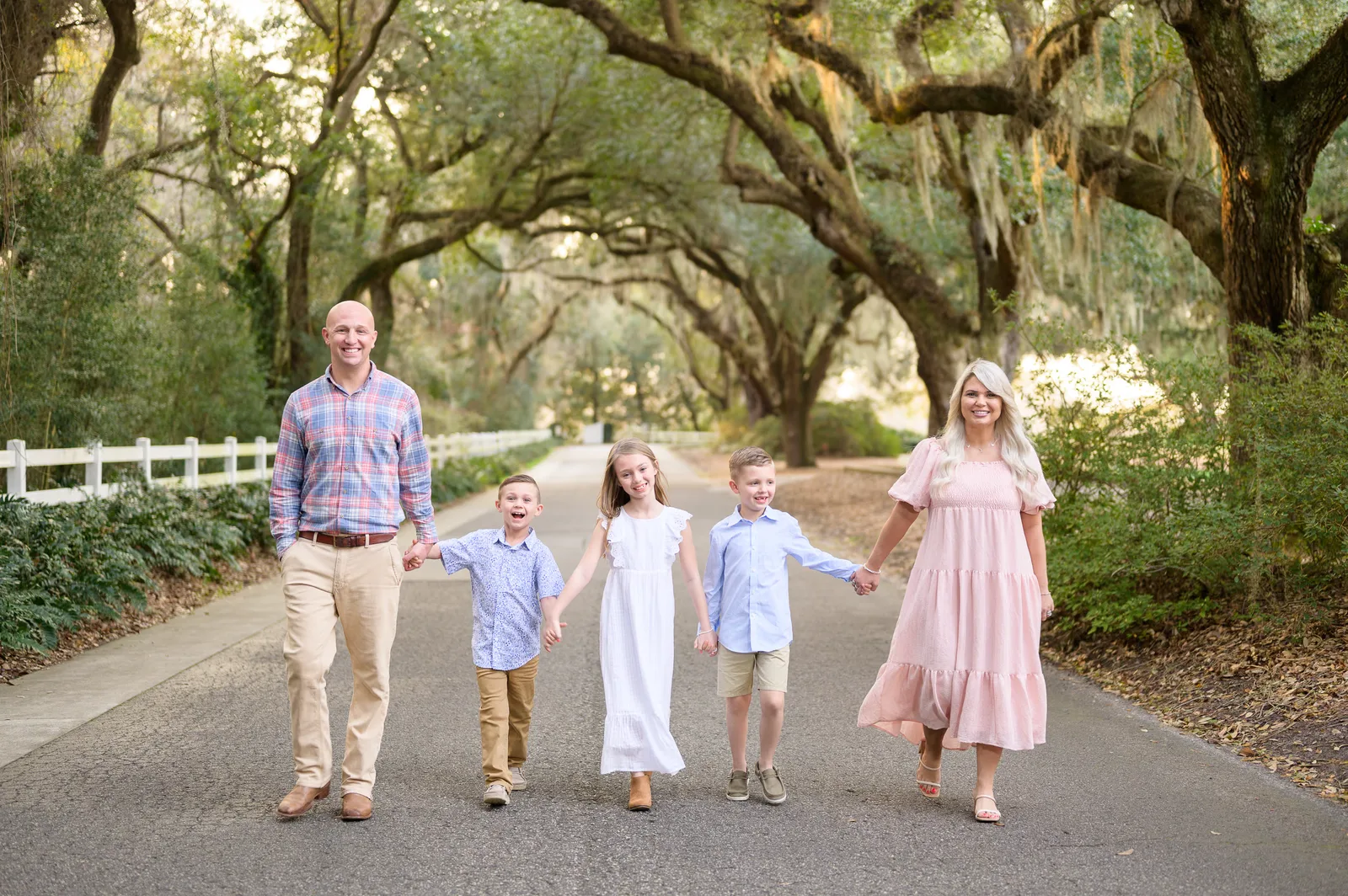 Family walking under the oaks - Caledonia Golf & Fish Club
