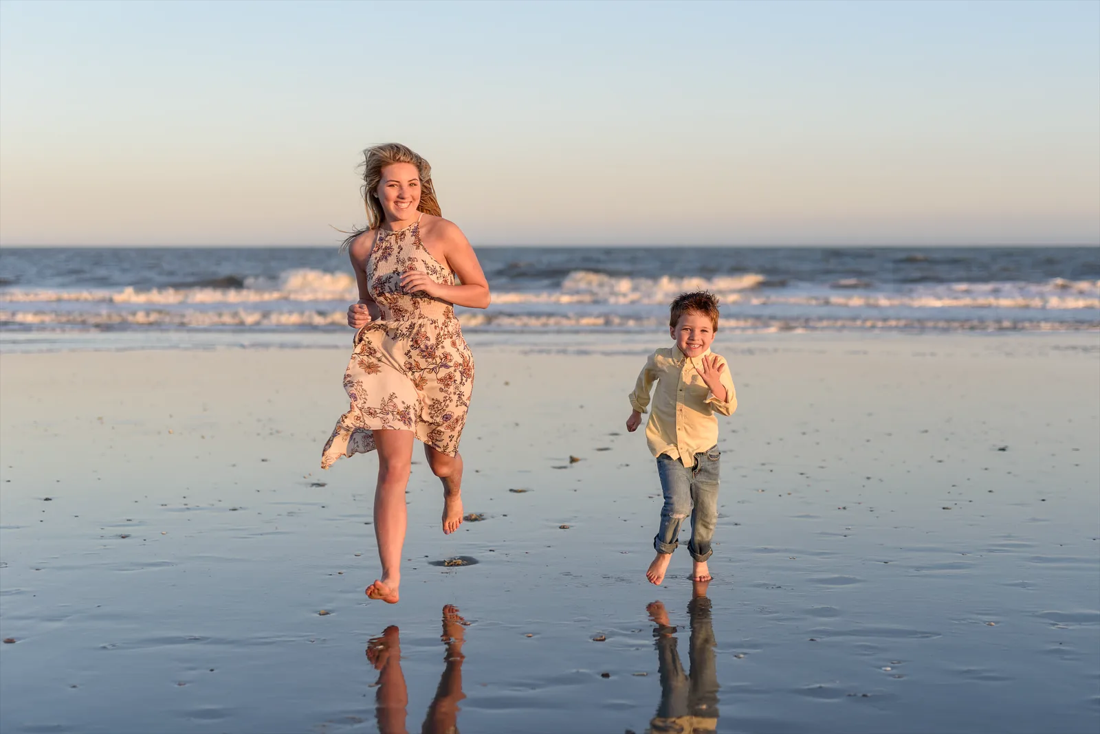 Brother and sister running down the beach - Myrtle Beach