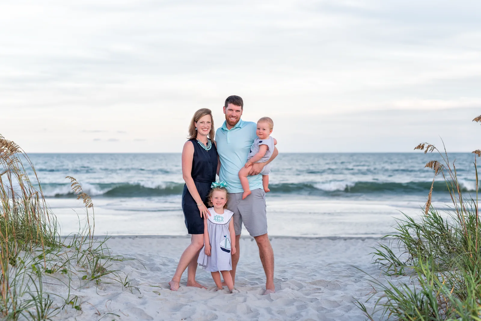 Mom and dad with the babies by the ocean - Myrtle Beach State Park