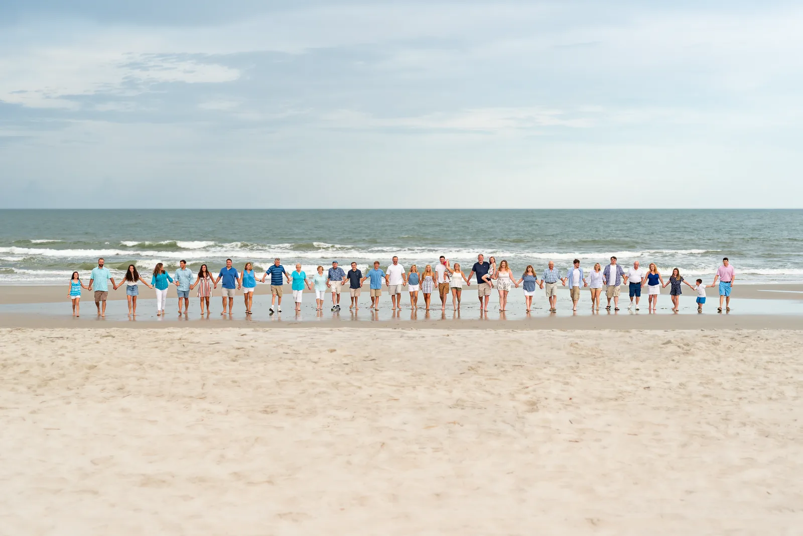 Huge family of 33 walking away from the ocean - Huntington Beach State Park