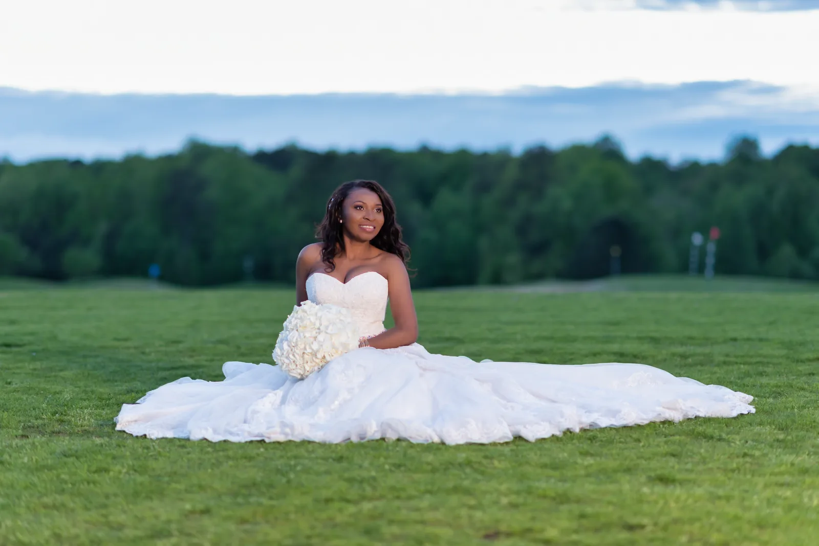 Bride looking into the light from the softbox - River Ridge Golf Club