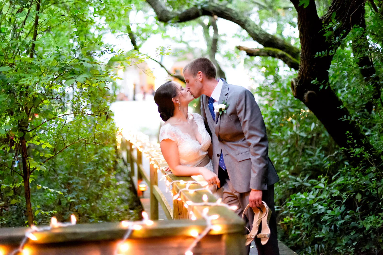 Couple sounded by trees and lights - The Pelican Inn
