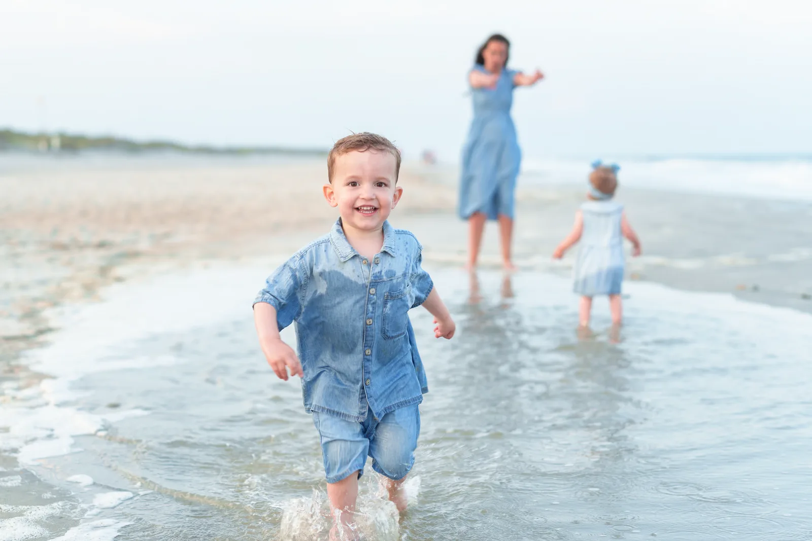 Little boy running through the water at the end of the photos - Pawleys Island