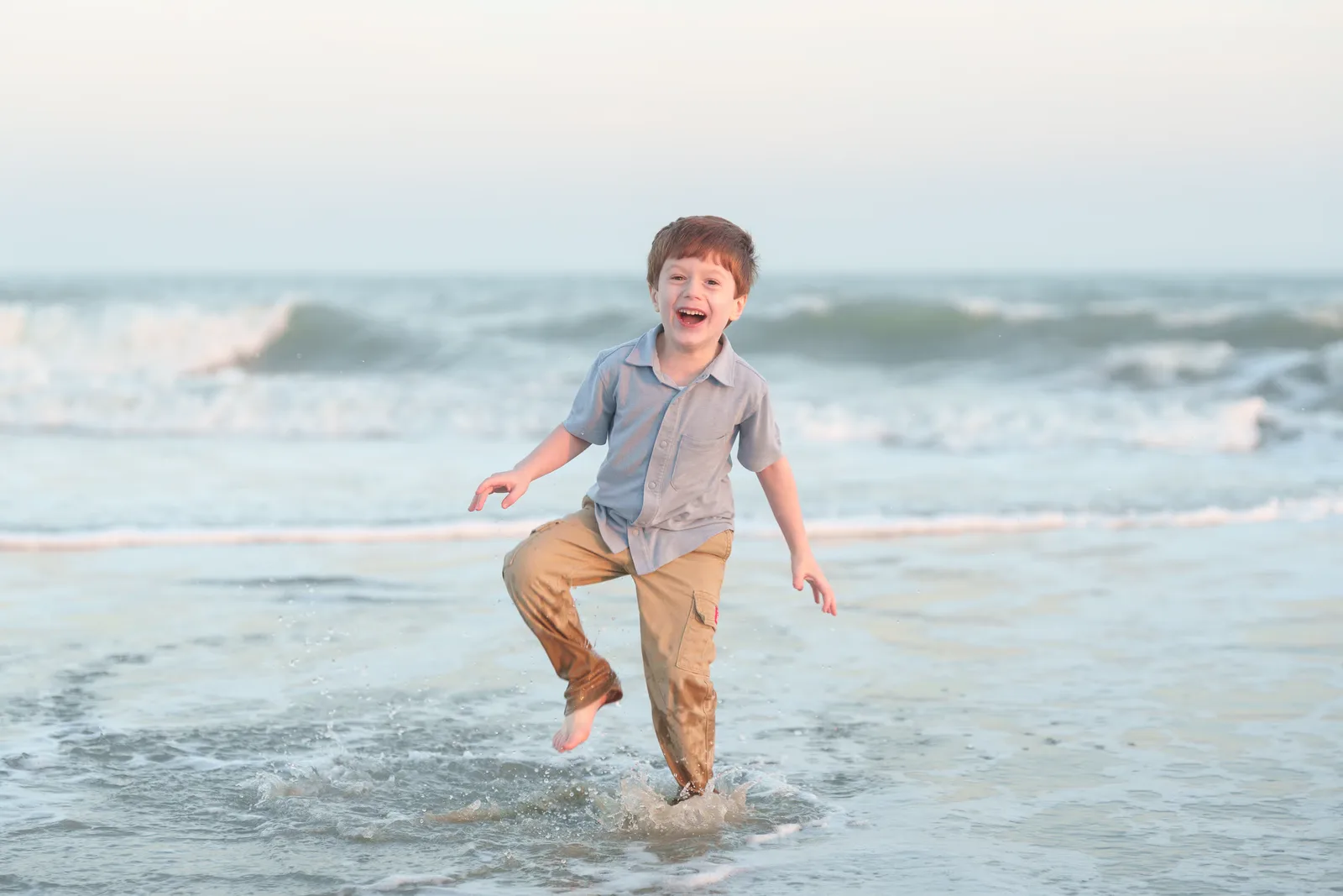 Boy jumping in the water - Huntington Beach State Park