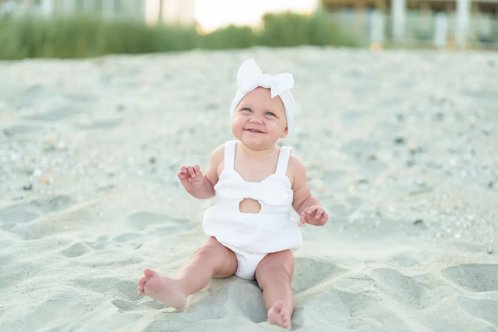 Toddler girl sitting by the dunes - Myrtle Beach