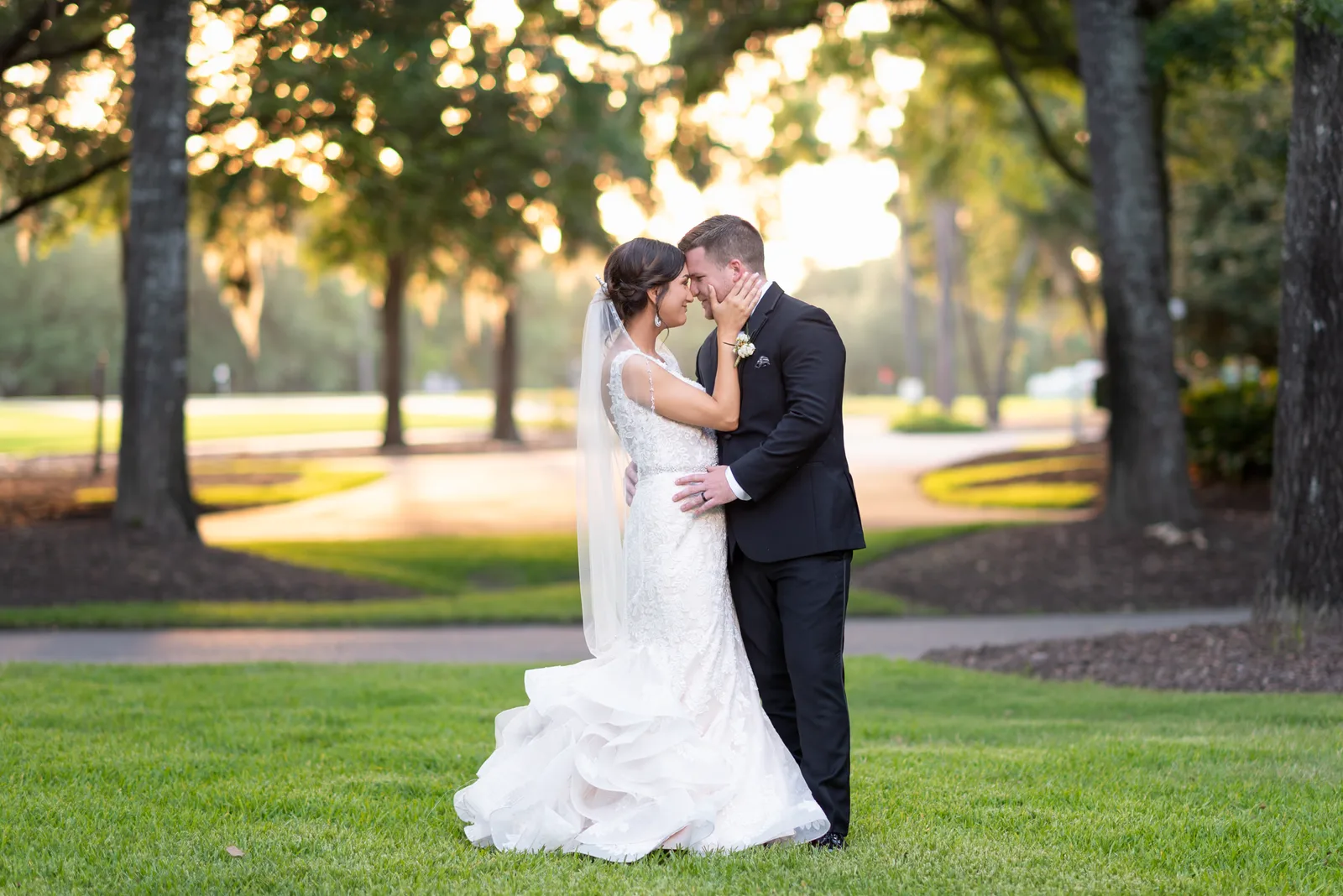 Touching the grooms face in front of Pawleys Plantation - Pawleys Plantation