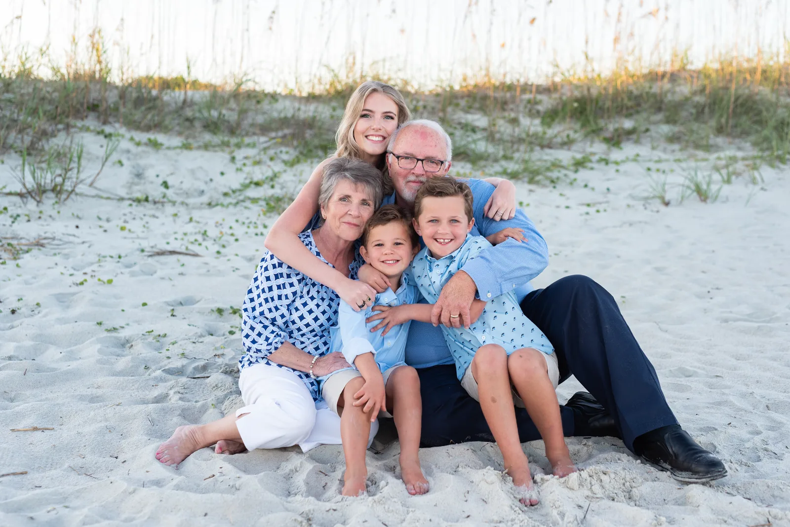 Kids giving grandparents a big hug - Huntington Beach State Park