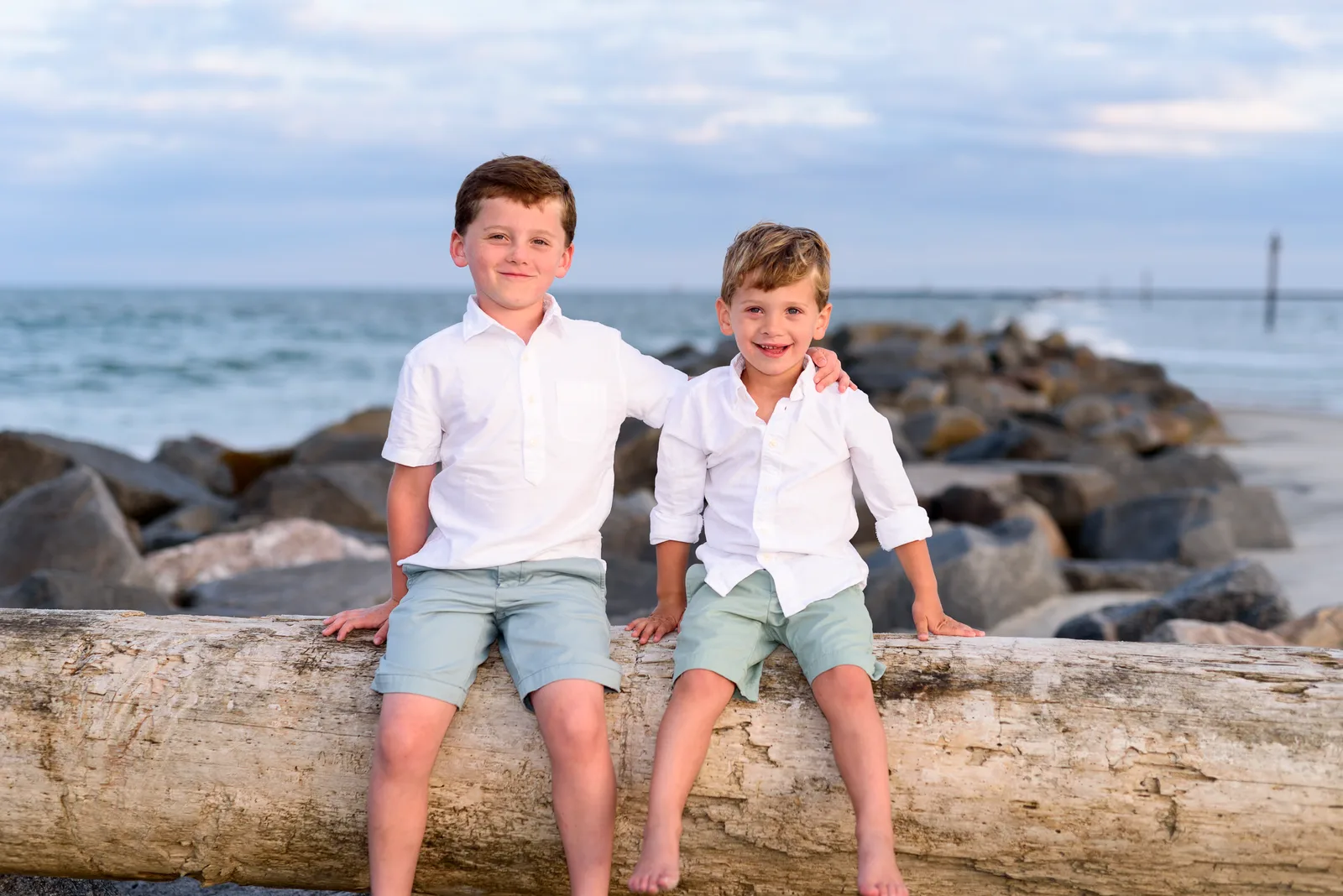 Brothers sitting on a beach jetty - Murrells Inlet