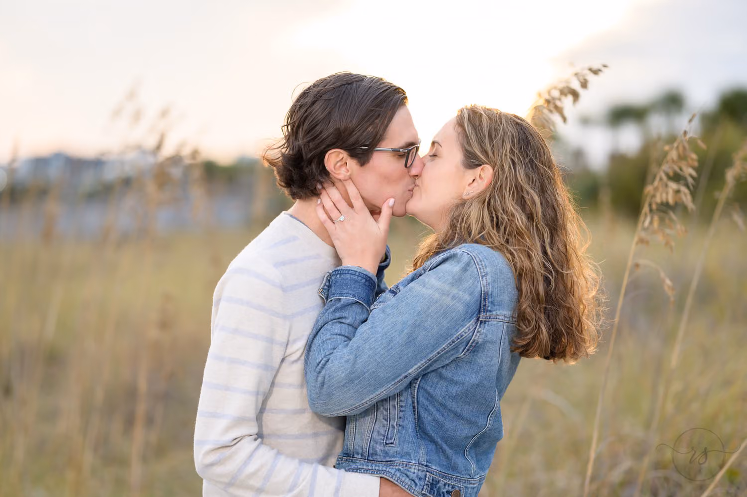 Close view of a couple kissing among tall sea oats behind the Marriott in Myrtle Beach