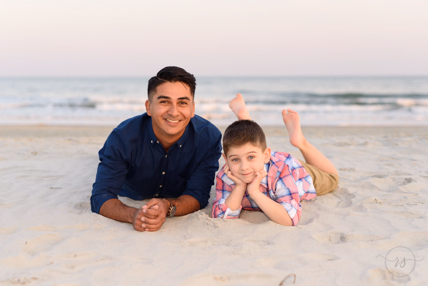 Brothers lying in the sand - Huntington Beach State Park