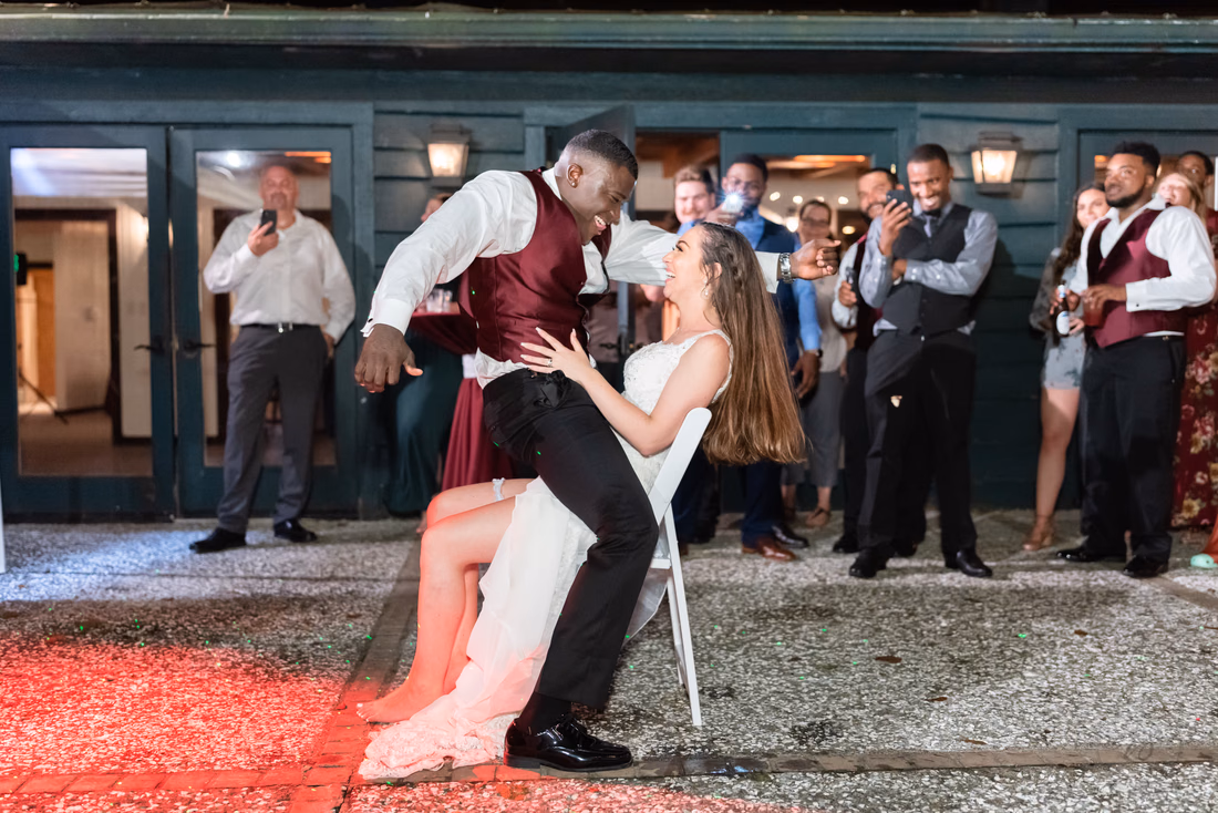 Groom getting wild taking off the garter - Magnolia Plantation - Charleston, SC