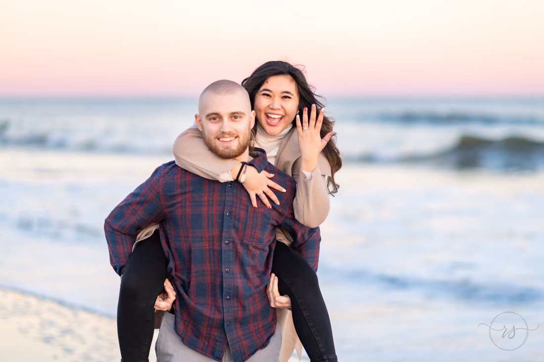 Piggyback ride showing off her engagement ring - Huntington Beach State Park