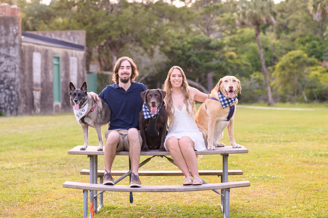 Sitting on a picnic table with the dogs - Huntington Beach State Park