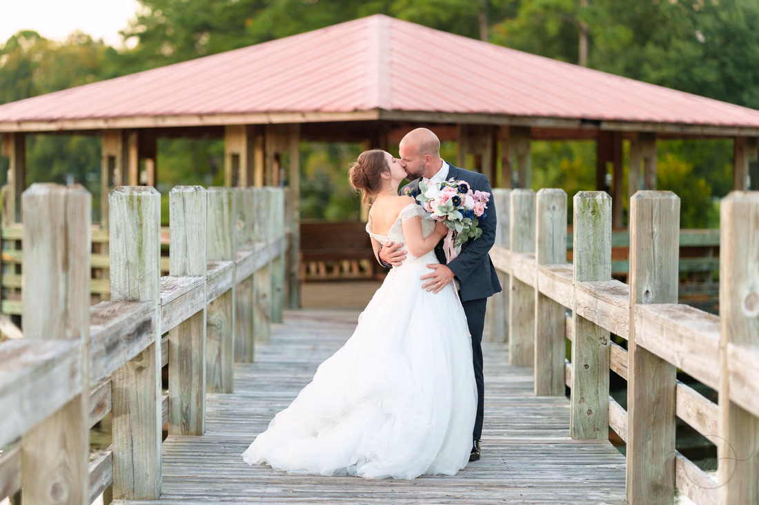 Kiss at the gazebo on the lake - The Pavilion at Pepper Plantation