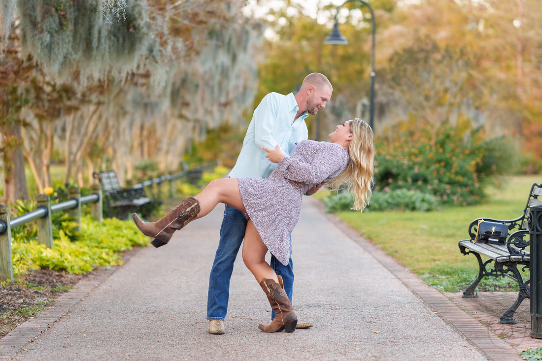 Dip back for a kiss showing off the cowboy boots - Conway Riverwalk