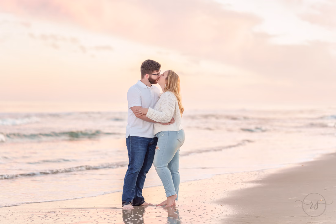 Kiss in front of the cotton candy clouds - Huntington Beach State Park