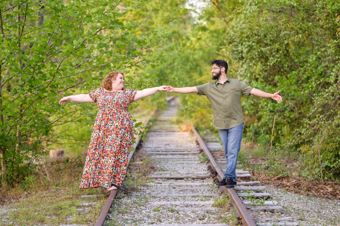 Walking down the train tracks together - Conway Riverwalk