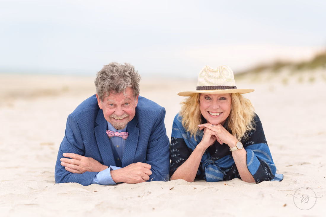 Fun couple lying in the sand together - Huntington Beach State Park
